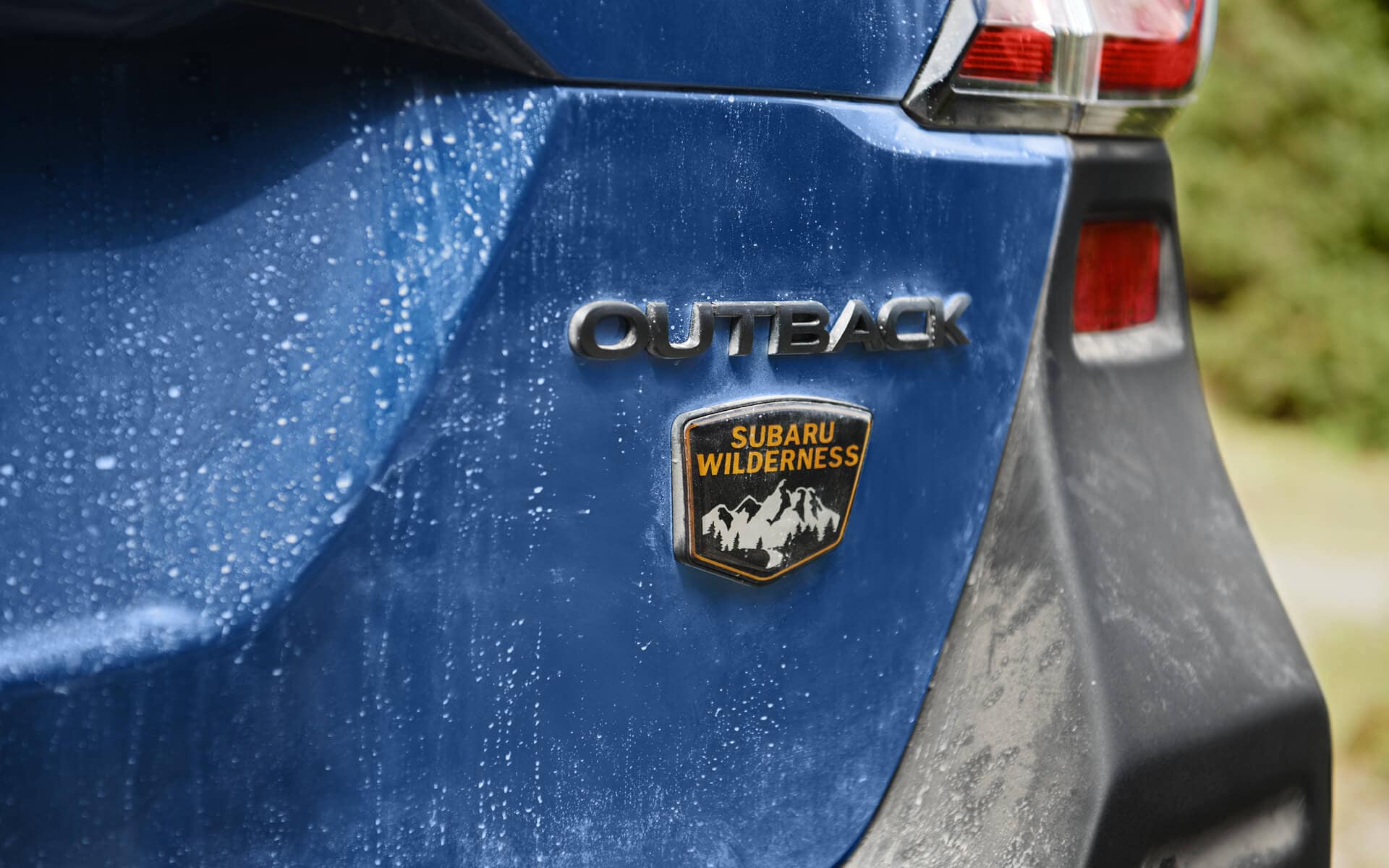A close up of the 2022 Subaru Outback Wilderness badge on the back bumper.